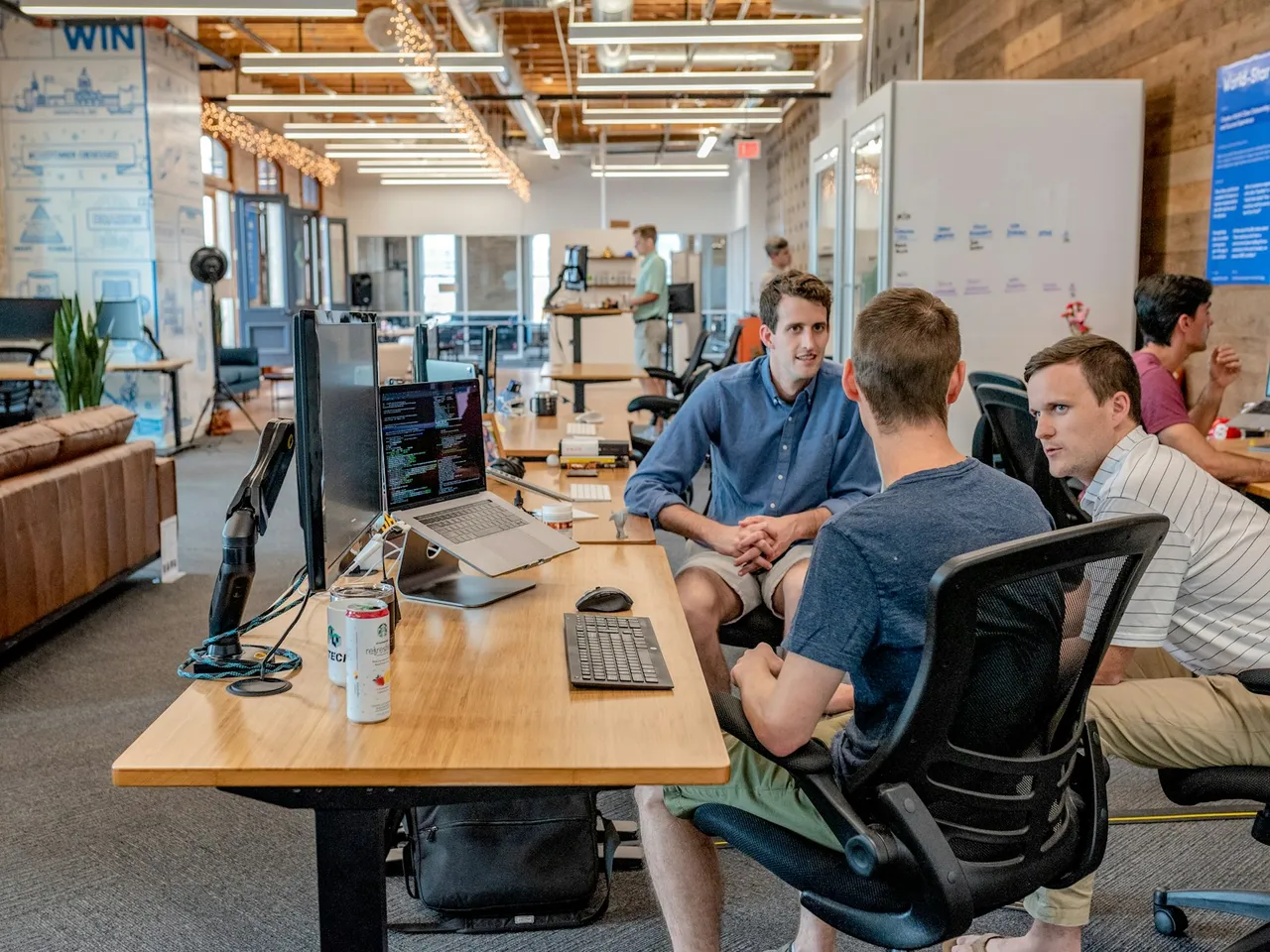 Team members comparing plans during a Northline working session